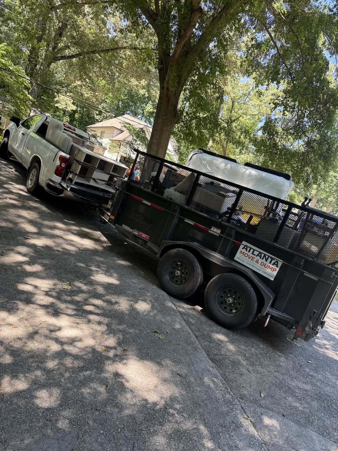 Atlanta Move & Dump truck and loaded trailer with household items